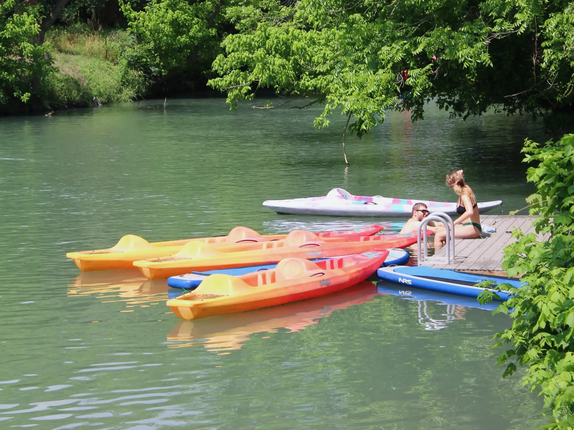 Spring-fed Geronimo Creek with kayaks and dock
