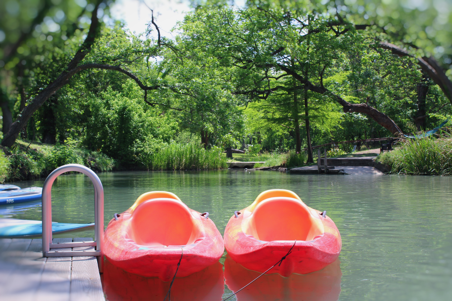 Kayaks at the dock on Geronimo Creek
