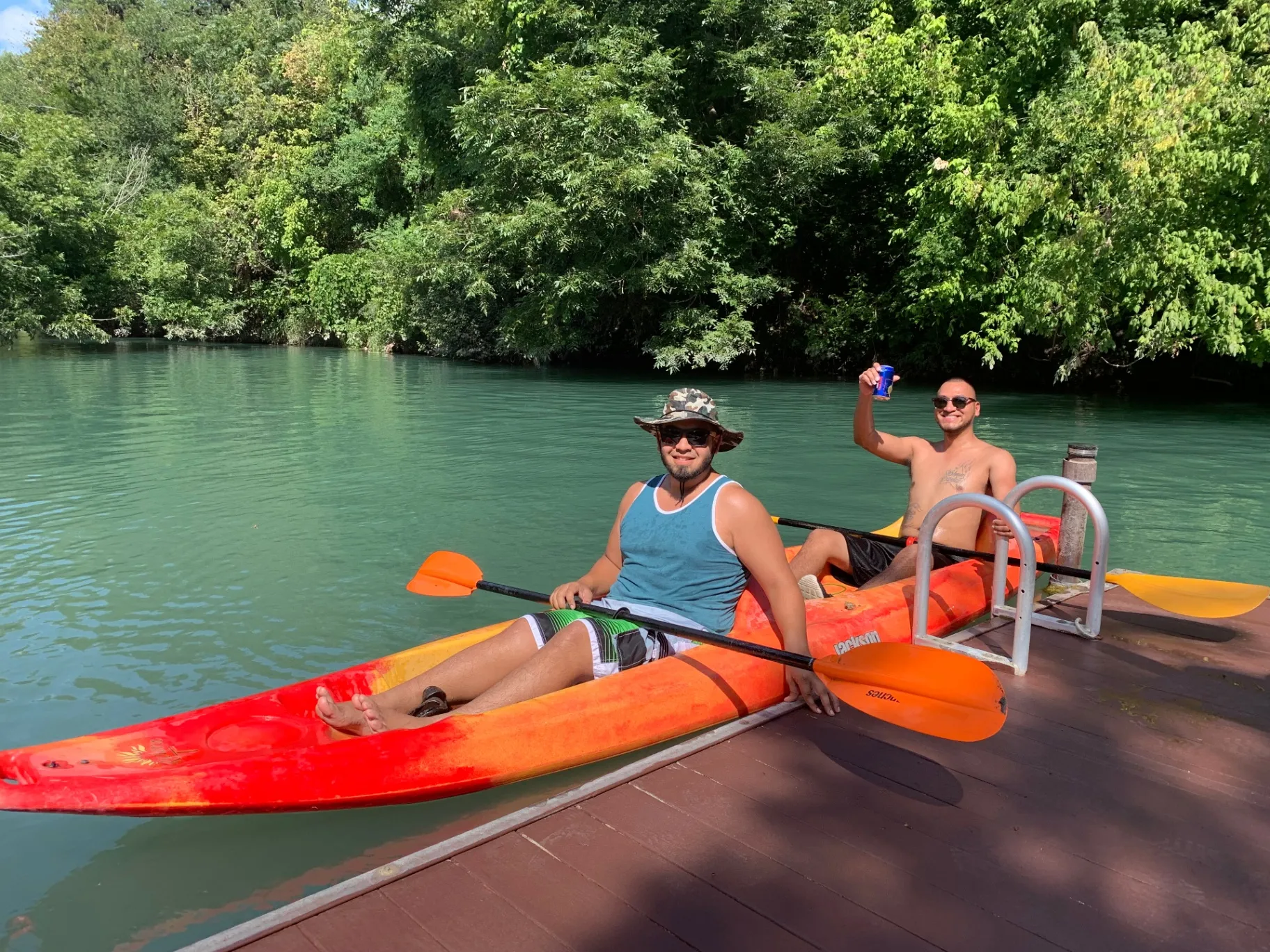 Friends kayaking on the creek