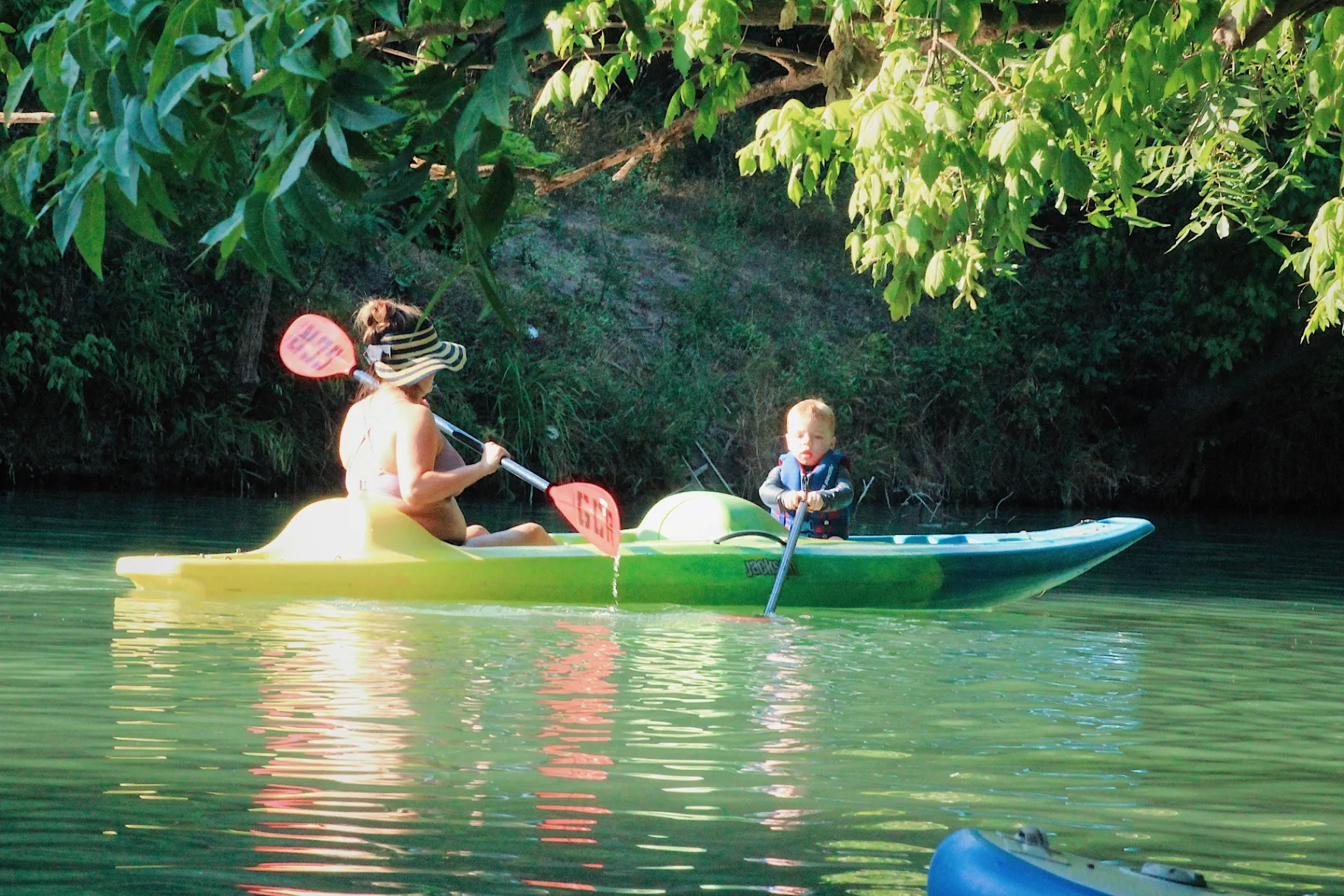 Mom and child kayaking together