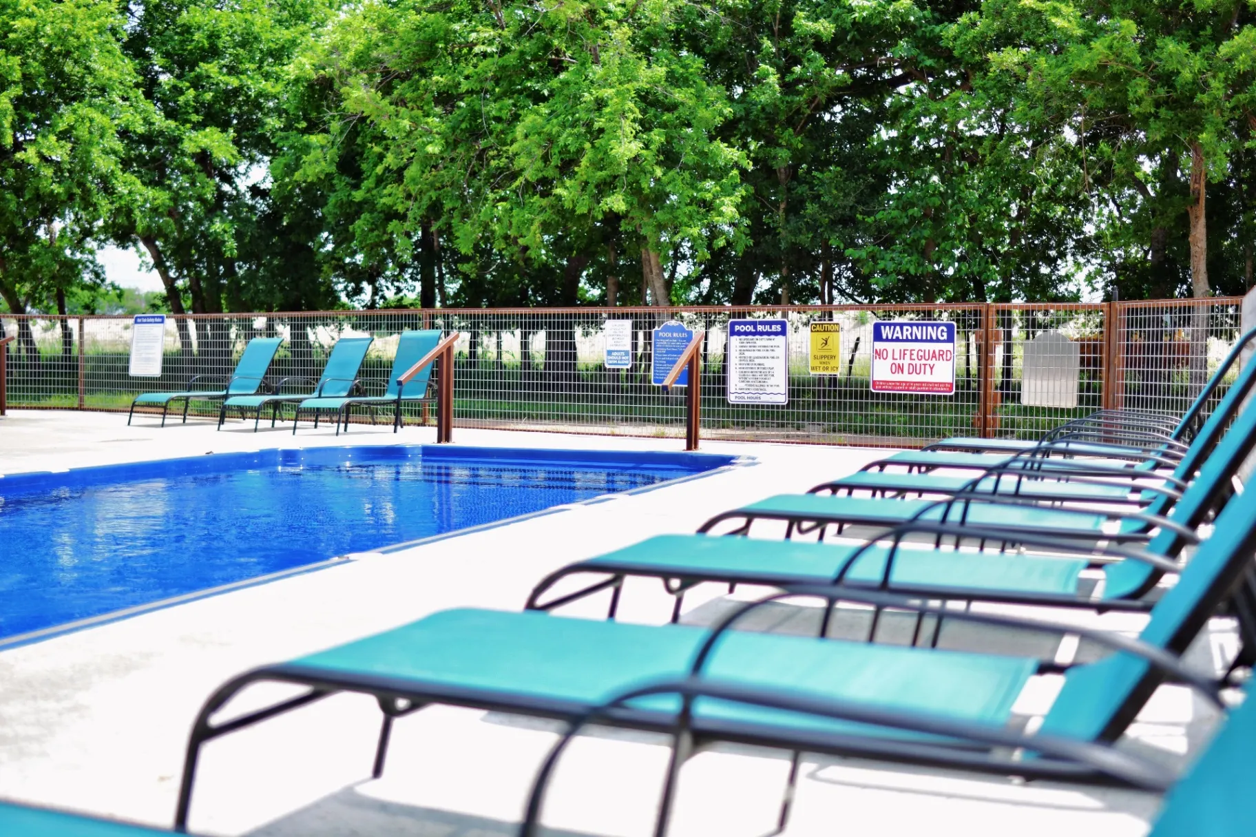 Pool area with lounge chairs
