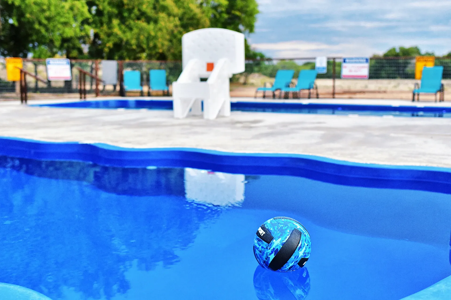 Heated pool with basketball hoop at family getaway near New Braunfels
