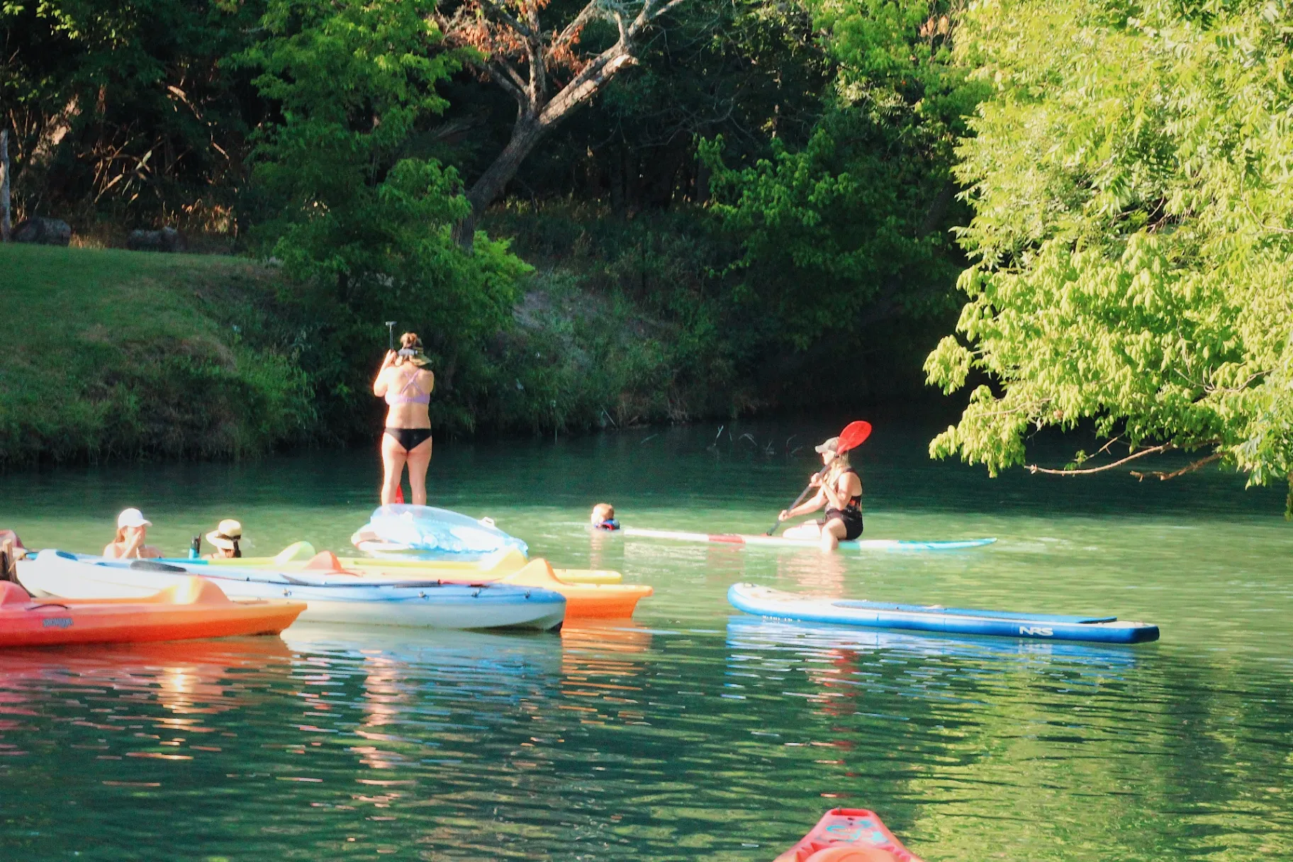 Family playing in Geronimo Creek on a Saturday family getaway near San Antonio