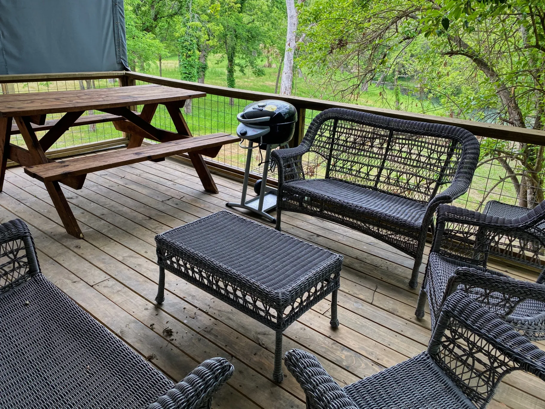 Covered deck seating outside a cabin